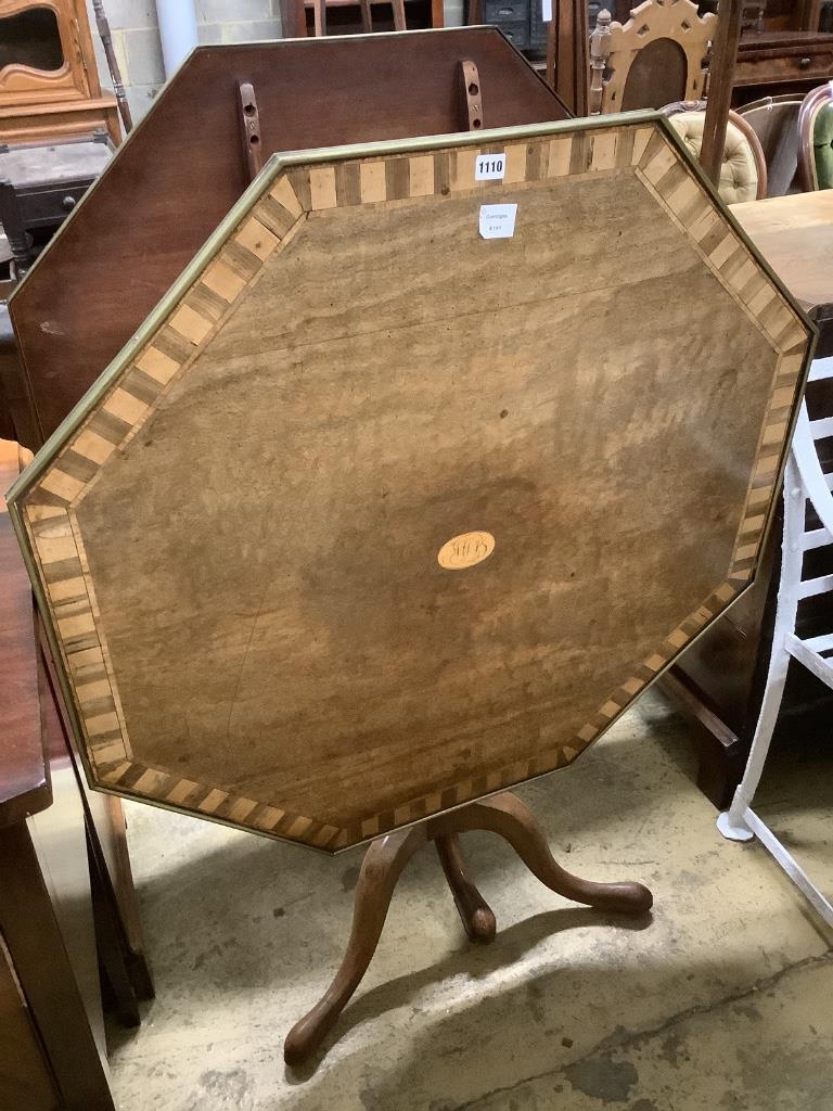 Two similar George III parquetry inlaid mahogany octagonal tilt top tables, width 96cm, height 73cm